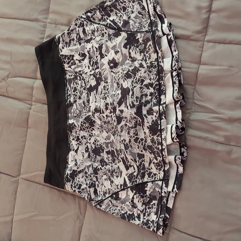 Lululemon black and white mottled skirt with black built in shorts.